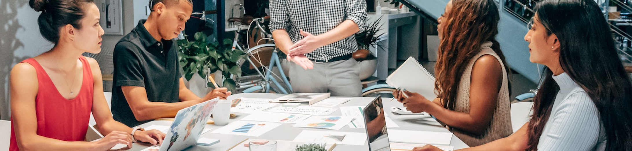 a group of small business employees discussing marketing strategy